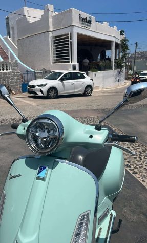 Vespa 300 in beautiful blue-green color in Santorin