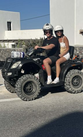Couple enjoying an ATV ride in Santorini